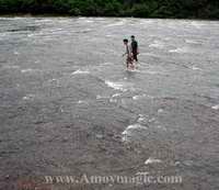 Two Chinese men walk on water in Ningde's Baishuiyang