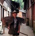 Bill Brown wearing handwoven palm fiber raincape and hat