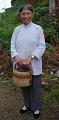 Granny with traditional charcoal-fired hand warmer (very dangerous; they've sent many a village ablaze; today they're being replaced by electric warmers)