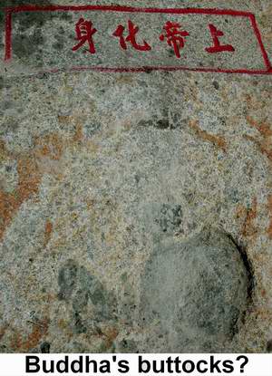 Buddha's derriere depression?  So they claim.  Buddha's buttocks in stone beside ancient Luoyang Bridge 