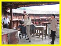 Len McClure filming inside a Hakka earthen castle