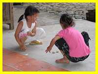 girls playing in a Nanjing Hakka round house